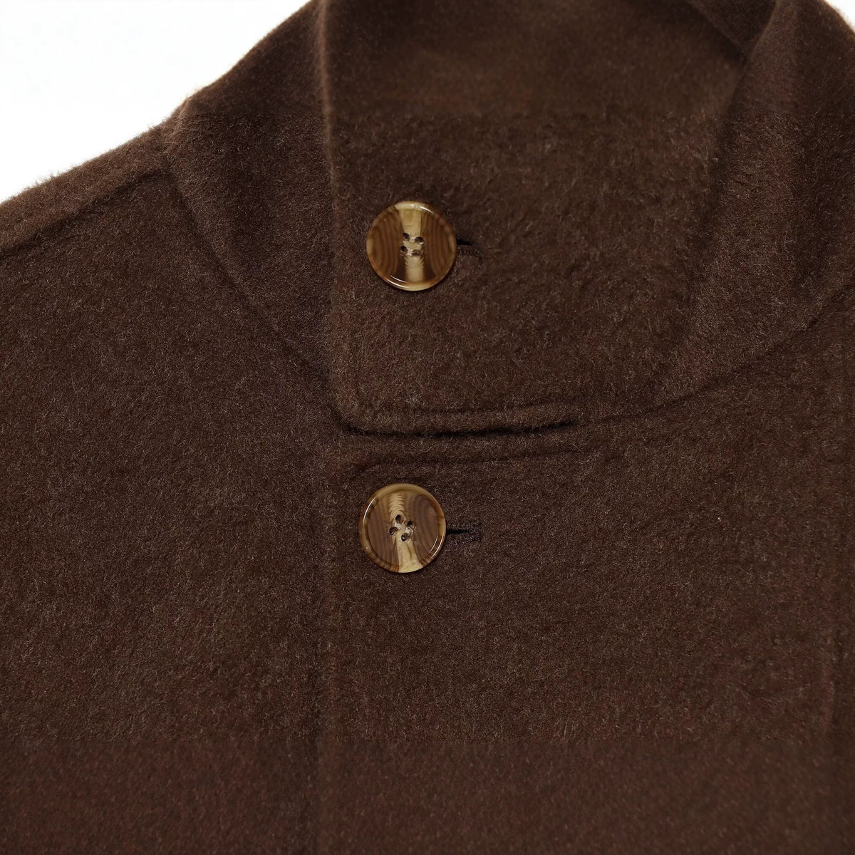 Wearing a long sleeved woolen jacket with a belt for women